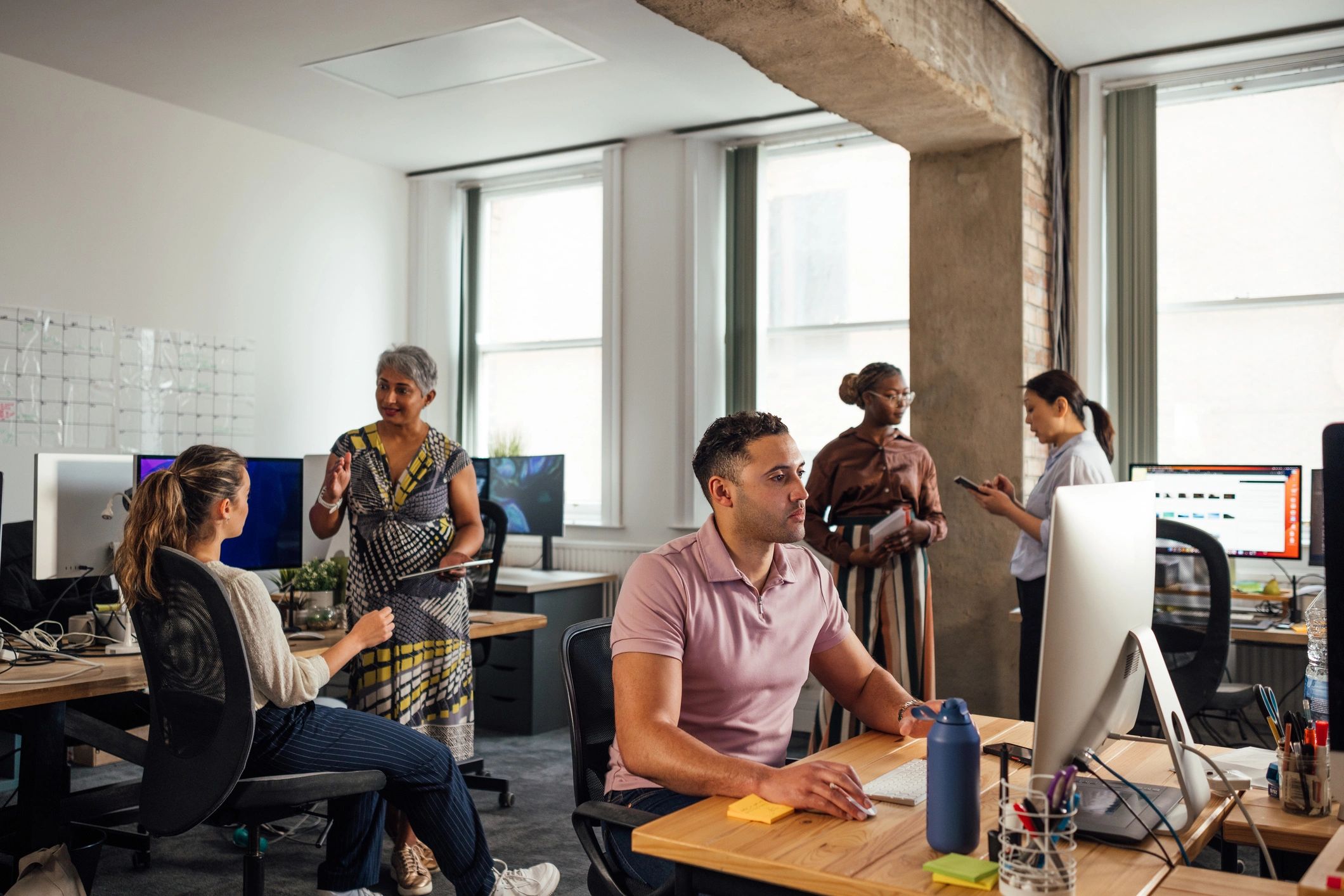 IT professionals collaborating in a modern office